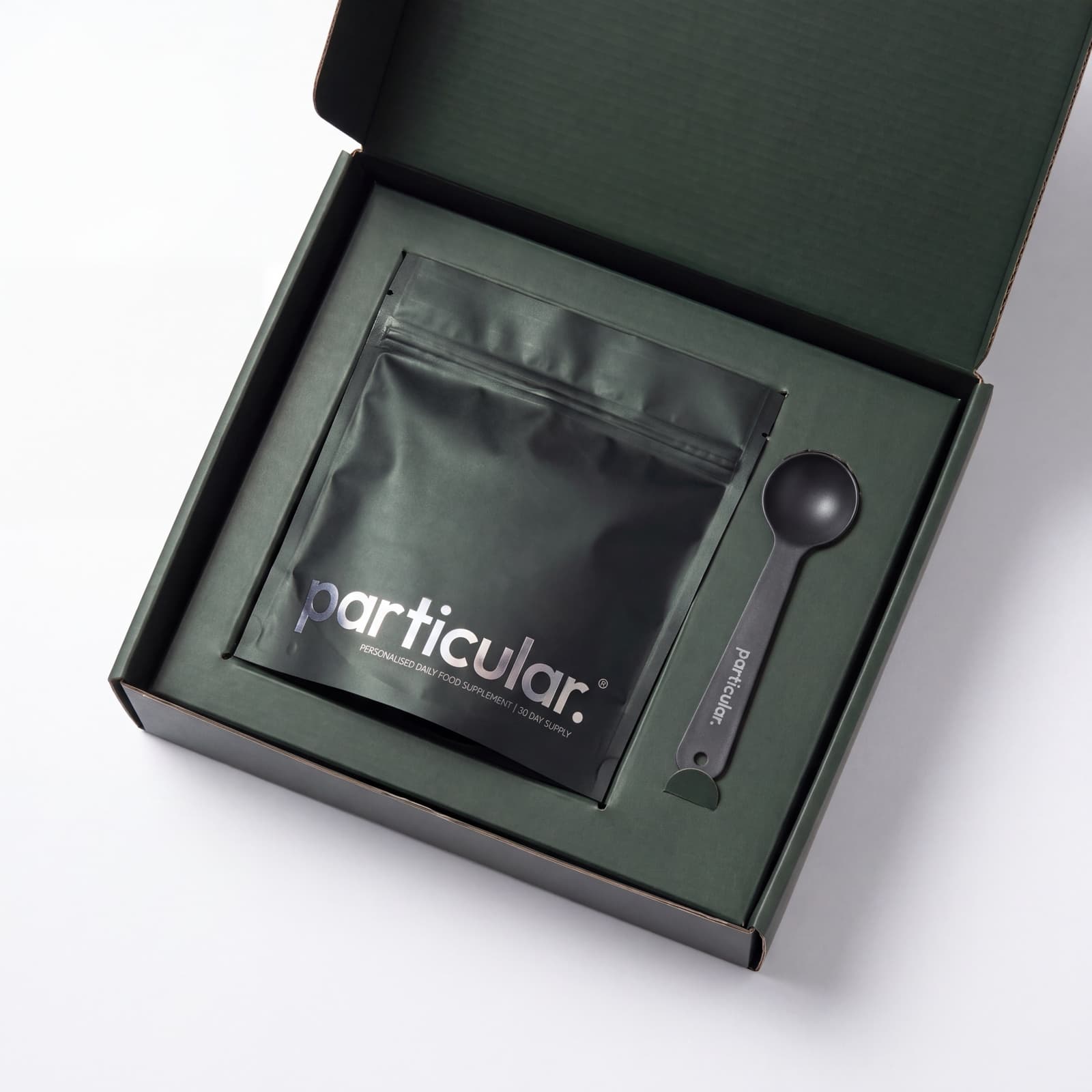 A Particular pouch and measuring scoop in their fitted presentation box